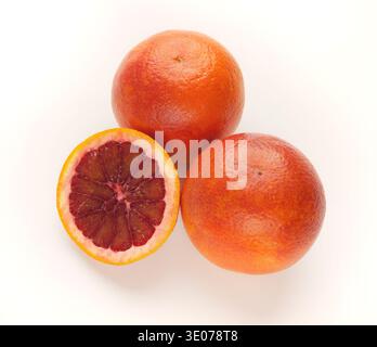Whole and cut bloody oranges isolated on white background Stock Photo