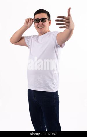 Businessman in blue suit gesturing to the camera Stock Photo