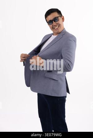 Businessman in blue blazer looking at camera Stock Photo