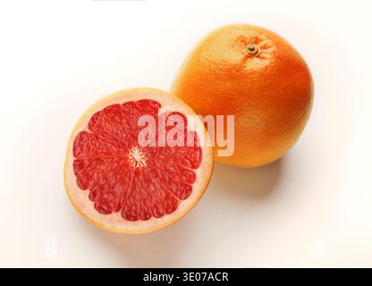 Whole and cut grapefruits isolated on white background Stock Photo
