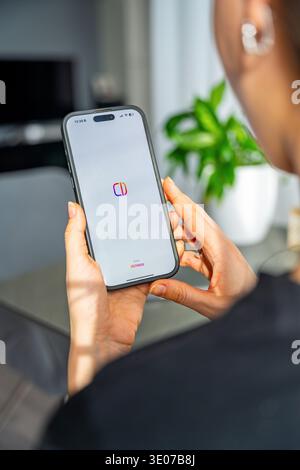 Prague, Czech Republic - February 19, 2026: Close up of woman hands holding smartphone with Edits video editing app open on screen. Mobile content Stock Photo