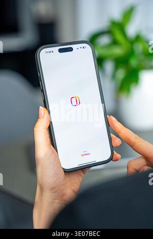 Prague, Czech Republic - February 19, 2026: Close up of woman hands holding smartphone with Edits video editing app open on screen. Mobile content Stock Photo