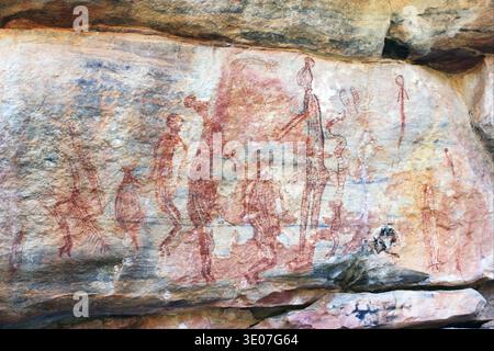 Aboriginal rock art depicts figures of Mimi Spirits on a cave wall ...