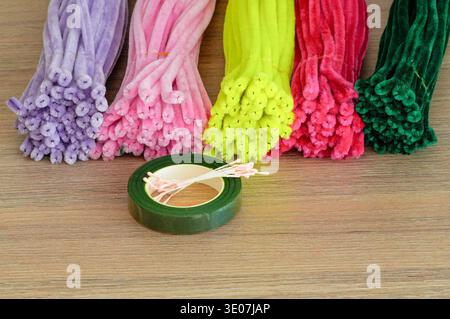 Colorful decorative wire on a wooden table, close-up photo Stock Photo