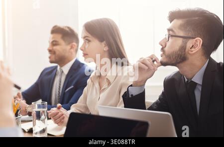 Young specialists attending business conference or training Stock Photo