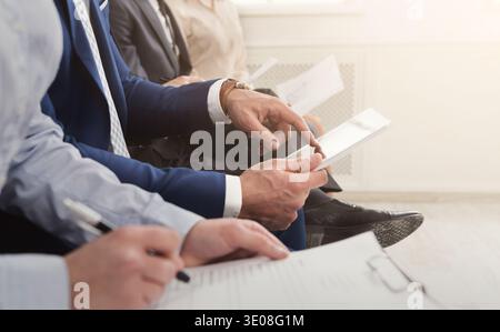 Multiracial people waiting in queue preparing for job interview Stock Photo
