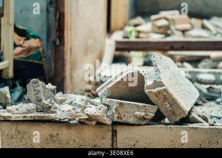 Demolished debris broken concrete and brick in abandoned construction site Stock Photo