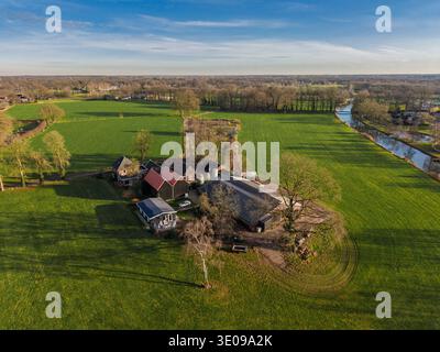 Aerial view of a rural farmstead featuring stacks of white and green ...