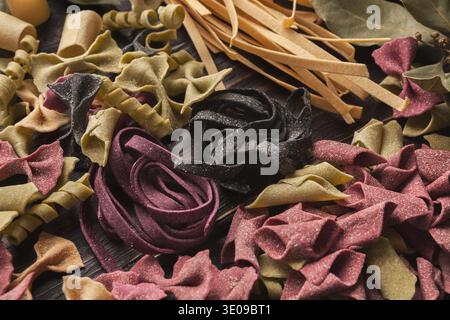 Colorful Pasta Collage Showing Different Shapes and Types on a Wooden Surface Stock Photo