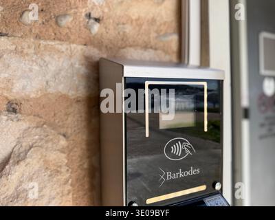 Electronic access control system with contactless reader installed on stone wall. Mobile photo Stock Photo