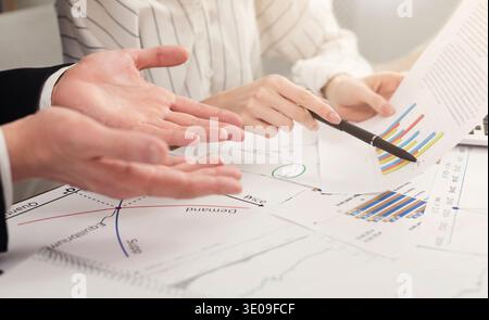 Team working on business project with financial reports Stock Photo