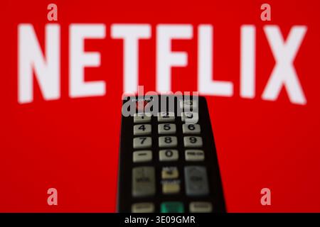 The Netflix logo display on a TV screen with a TV remote in Ontario, Canada, on February 1, 2026 Stock Photo