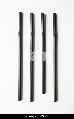 Black straws arranged in line. Concept of OCD, Obsessive compulsive personality disorder. Stock Photo