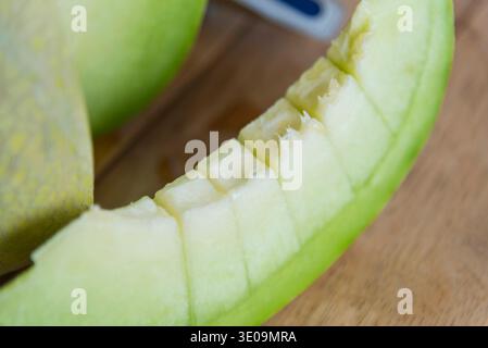 Fresh green melon on wood plate Stock Photo