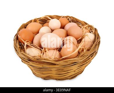 Basket with eggs on white background Stock Photo
