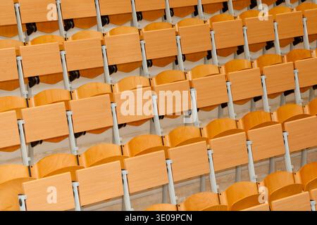 Empty classroom with wood chairs. Stock Photo