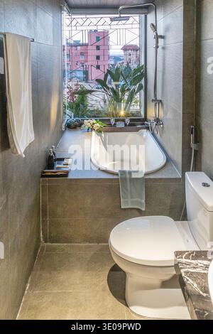 A long narrow bathroom in a hotel in Da Lat, Vietnam. Stock Photo