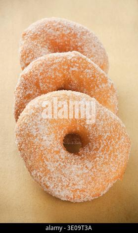 Donuts on beige paper background Stock Photo