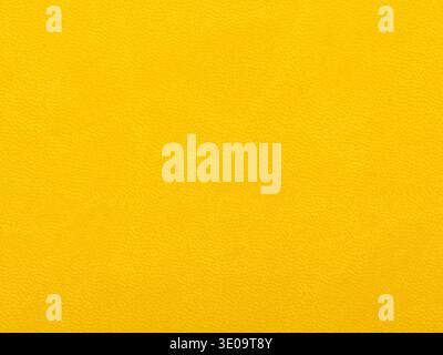 Abstract texture of synthetic leather, yellow background. Stock Photo