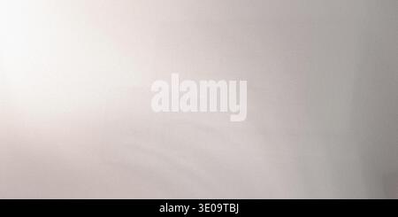 A gray background with a subtle gradient effect and a textured surface, transitioning from light to dark gray Stock Photo
