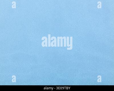 Abstract texture of synthetic leather, blue light background. Stock Photo