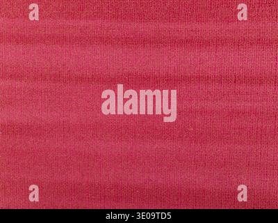 Abstract texture of synthetic leather, red background. Stock Photo