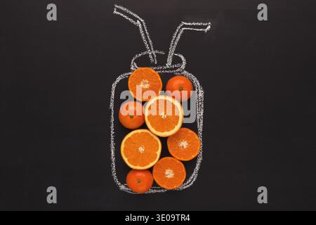 Citrus fruits in chalk drawn jar on black background Stock Photo