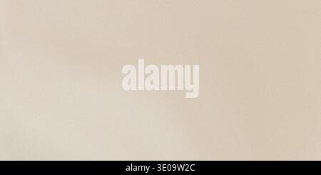 This image showcases a beige colored background with a smooth texture and a plain surface, devoid of any distinct features or objects, with a uniform Stock Photo