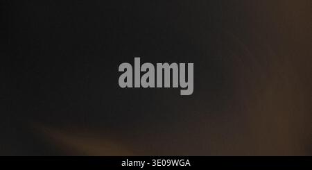 This image features a dark brown background with a smooth texture and a subtle gradient effect that transitions from a lighter brown to a deeper brown Stock Photo