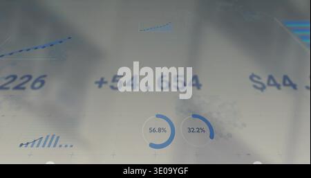 Displaying analytics dashboard on pale translucent surface showing +54 Stock Photo
