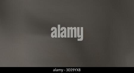 Dark gray leather texture featuring visible wrinkles and creases, highlighting its rugged and worn appearance with natural grain Stock Photo