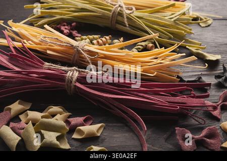 Various types of handmade pasta on black background Stock Photo