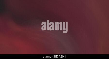 An abstract image dominated by deep burgundy and dark red tones. The texture is grainy with soft, blurry transitions suggesting movement or depth in a Stock Photo