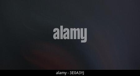 Close-up of dark brown leather with smooth surface and subtle sheen, showcasing natural material Stock Photo
