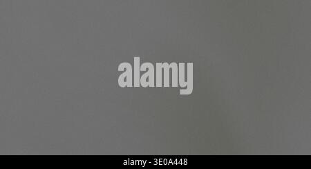 A detailed, high-resolution photograph showcasing the fine, slightly rough texture of a dark gray material, possibly felt or heavy cloth, suitable for Stock Photo