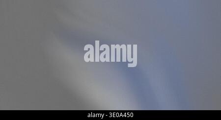 A gray and blue gradient background image with a white highlight in the center, creating a smooth transition of colors Stock Photo