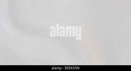 A detailed, high-resolution image showcasing the fine texture of a light gray fabric, featuring gentle undulations and a matte finish suitable for bac Stock Photo