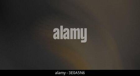 An abstract image dominated by a dark, heavily textured surface with visible digital noise or grain. A very subtle, faint orange or amber diagonal lin Stock Photo