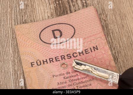 Pink paper driver's license, car keys, detail, wood background, Stock Photo