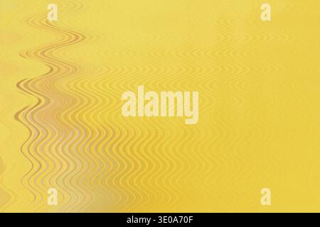 An abstract image featuring a predominantly yellow textured surface overlaid with a vertical, undulating wave pattern on the left side, creating a sen Stock Photo