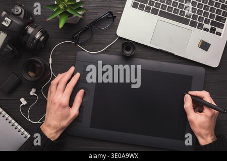 Designer hand with graphic tablet and keyboard Stock Photo