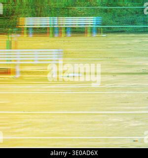 Experimental long-exposure photograph creates a vibrant, blurred impression of a tennis court, benches and white court lines. Stock Photo
