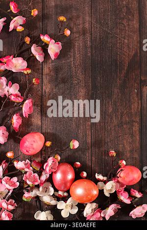 Beautiful Easter banner with decorated quail eggs, sakura and cherry blossom branches, spring butterflies, and feathers. Happy Easter concept. Abstrac Stock Photo