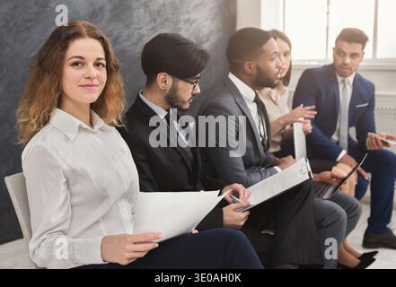 Multiracial people waiting in queue preparing for job interview Stock Photo
