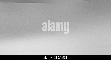 A close-up, abstract view of a silver metallic surface featuring a fine, uniform grain or noise texture. The lighting creates a subtle horizontal grad Stock Photo