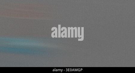A detailed view of a grainy, gray textured surface, possibly concrete or heavy paper, interrupted by a distinct, horizontal streak of light blue illum Stock Photo