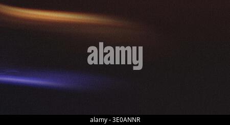 A dark, textured surface featuring two distinct, horizontal beams of light—one vibrant blue and the other warm orange—cutting across the frame, overla Stock Photo