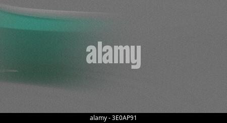 A monochromatic gray, noisy texture overlaid with a subtle, horizontal streak of vibrant green light on the left side, suggesting motion or digital in Stock Photo