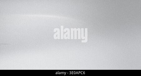 A close-up view of a fine, silver-toned texture resembling glitter or metallic dust, featuring subtle variations in light and shadow across the surfac Stock Photo