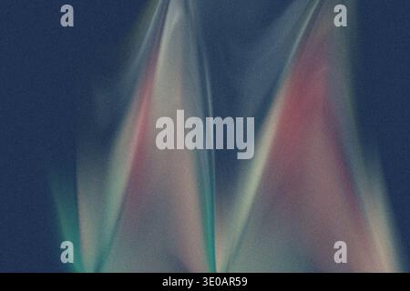 An abstract composition set against a dark, grainy blue background, featuring soft, upward-moving streaks of light in muted shades of pink, teal, and Stock Photo
